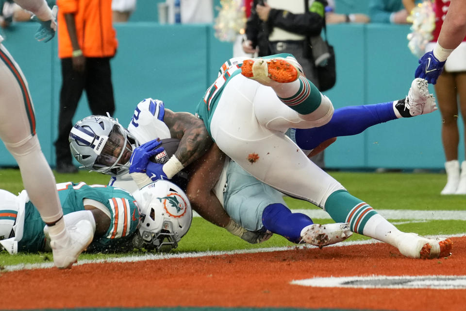 Dallas Cowboys running back Tony Pollard (20) is stopped short of the goal line during the first half of an NFL football game against the Miami Dolphins, Sunday, Dec. 24, 2023, in Miami Gardens, Fla. (AP Photo/Rebecca Blackwell)