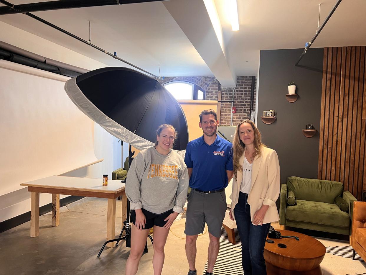 Intern Molly Duncan (right) poses with Vella Crew owners Suzanne and Phillip Young inside the studio at Kern's Food Hall. Wednesday, April 17, 2024.