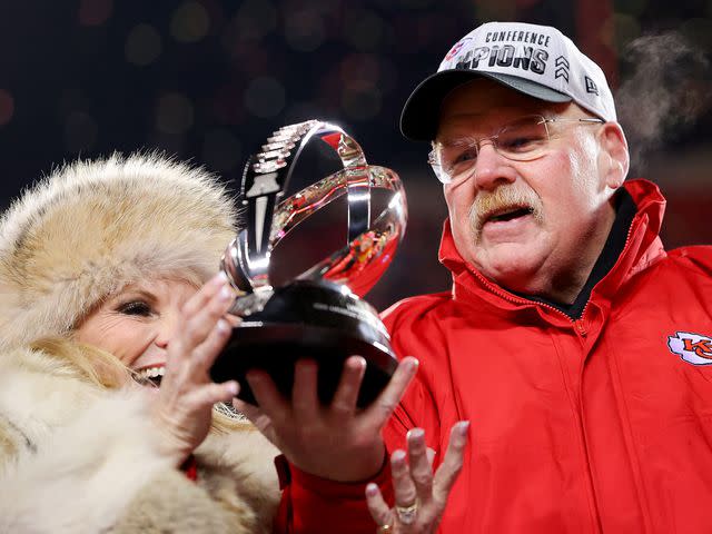 Kevin C. Cox/Getty Tammy Reid and Andy Reid of the Kansas City Chiefs hold up the Lamar Hunt Trophy in January 2023.