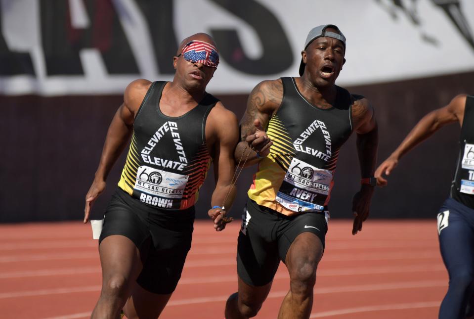 David Brown (left) runs with guide Jerome Avery in the visually impaired paralympic 200m during the 60th Mt. San Antonio College Relays at Murdock Stadium.