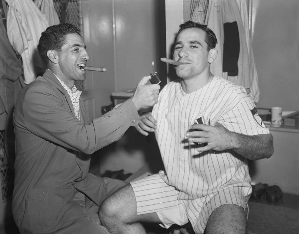 The New York Yankees' Phil Rizzuto (L)and Yogi Berra
