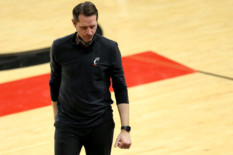 Cincinnati Bearcats head coach John Brannen walks back to the bench in the second half of a men's NCAA basketball game, Sunday, Feb. 28, 2021, at Fifth Third Arena in Cincinnati. The Memphis Tigers won, 80-74.