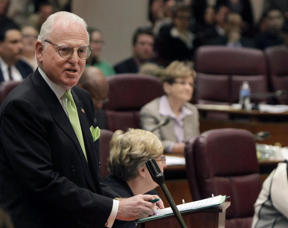 FILE - In this May, 4, 2011 file photo, Chicago Ald. Ed Burke speaks at a City Council meeting in Chicago. The Chicago Tribune says federal agents executed search warrants at the City Hall office of the powerful Chicago alderman. An unidentified law enforcement source told the Tribune agents arrive at Ed Burke's aldermanic office Thursday Nov. 29, 2018 morning, told staff to leave and pulled brown paper across its glass doors blocking the view. (AP Photo/M. Spencer Green, File)