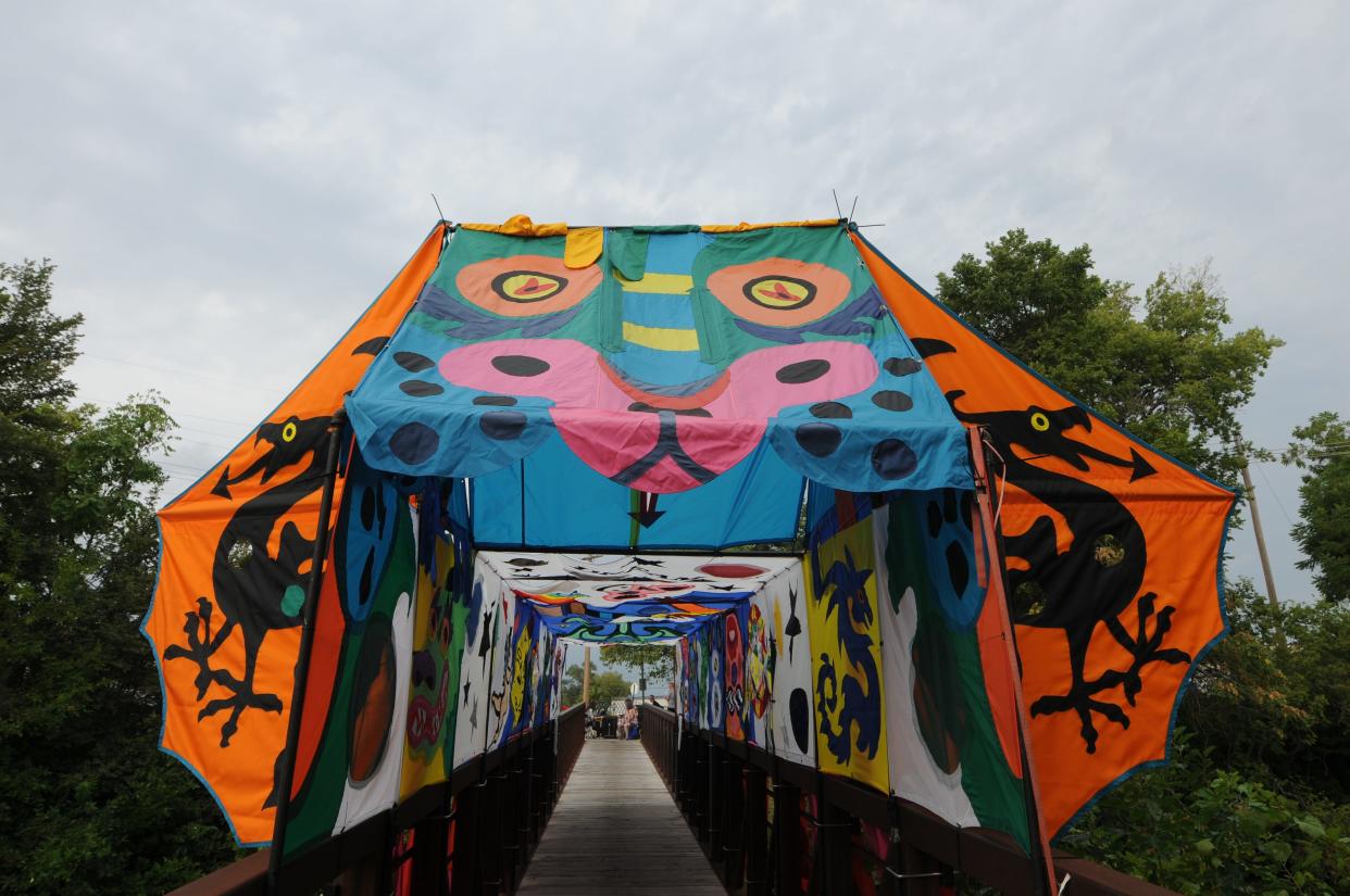 The colorful entrance covering the Fourth Street bridge entrance to the 2021 Smoky Hill River Festival.