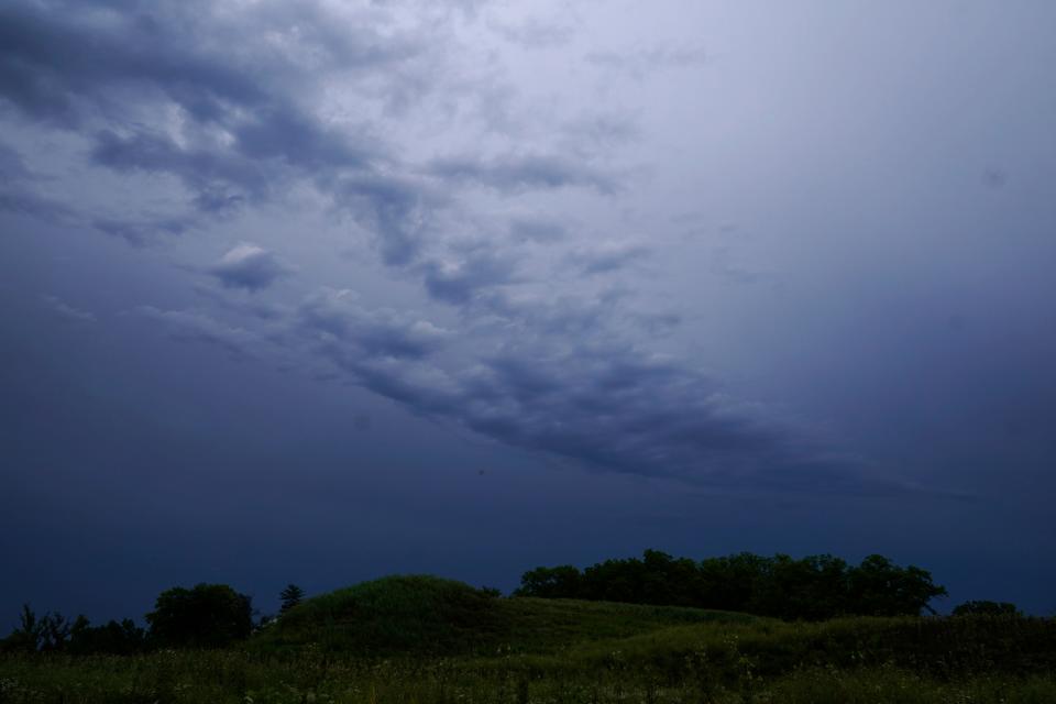 Dark clouds pass over a field in Lake Forest, Ill., on, July 26, 2023. The summer of 2023 has been a hot and stormy one for large parts of the nation.