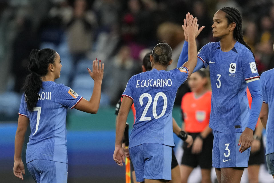 France's Wendie Renard greets France's Estelle Cascarino after the Women's World Cup Group F soccer match between France and Jamaica at the Sydney Football Stadium in Sydney, Australia, Sunday, July 23, 2023. The match ended in a 0-0 draw. (AP Photo/Mark Baker)