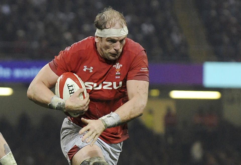 FILE - In this file photo dated Saturday, Feb. 23, 2019, Wales Alun Wyn Jones runs at England during the Six Nations rugby union international match at the Principality Stadium in Cardiff, Wales. Captain Alun Wyn Jones has a chance to win his third Grand Slam, when Wales face-off against Ireland upcoming Saturday March 16, 2019. (AP Photo/Rui Vieira, FILE)