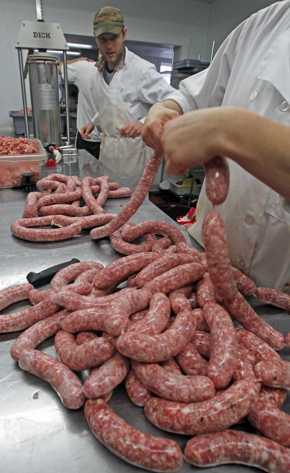 In a Dec. 20, 2012 photo, Pete Colman makes sausage, in East Montpelier, Vt. Along with its craft beer, artisan cheese and a demand for locally produced foods, Vermont is hoping to expand production of speciality cured meats as it works to develop a meat industry in a state that has been primarily dominated by dairy cows. (AP Photo/Toby Talbot)