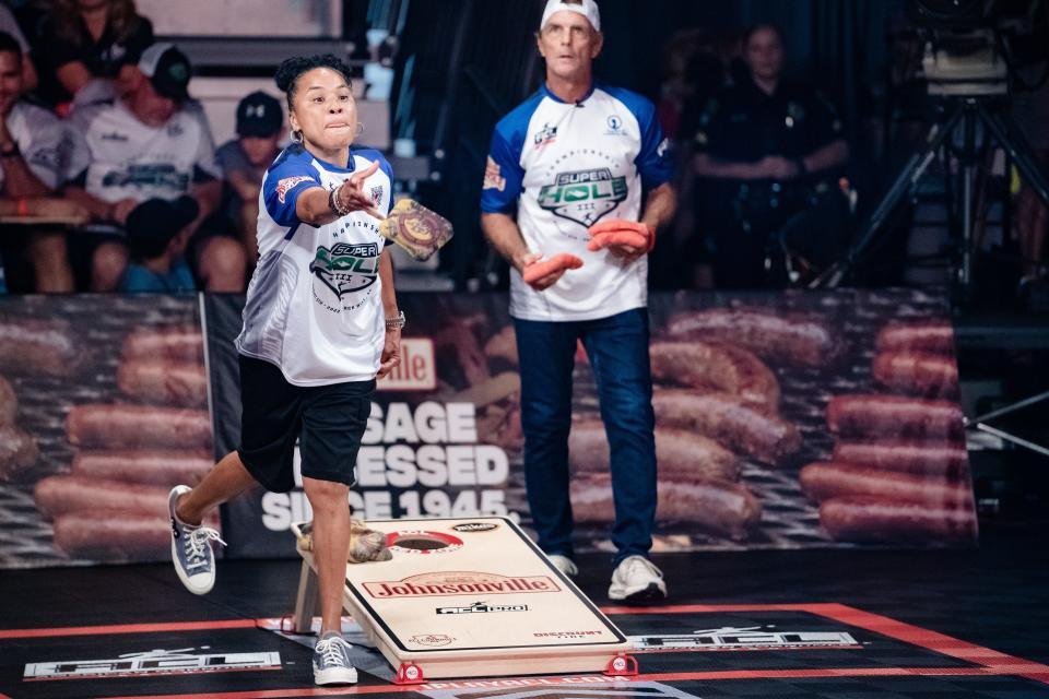 Doug Flutie and Dawn Staley competing in ACL SuperHole III Finals at the Rock Hill Sports & Event Center in 2022.