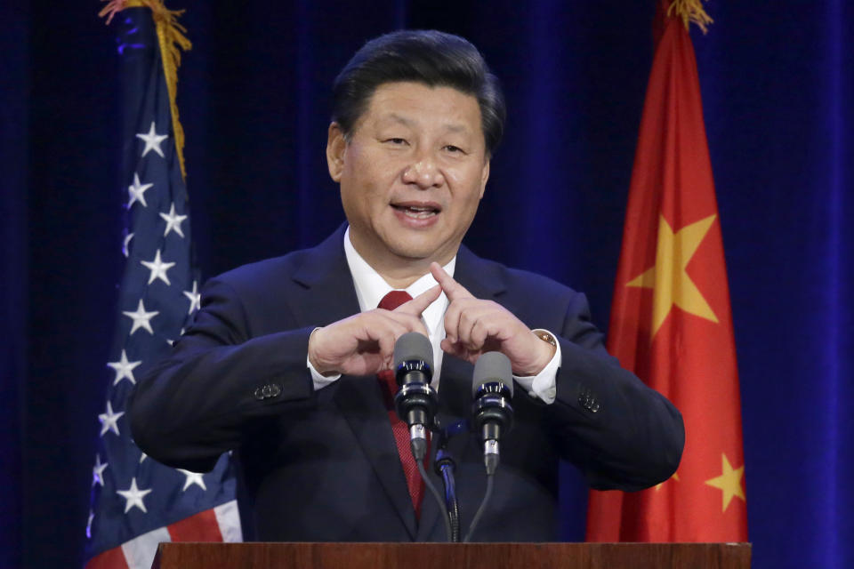 FILE - Chinese President Xi Jinping talks about how the Chinese symbol for the word "people" resembles two sticks supporting each other as he speaks at a banquet in Seattle, on Sept. 22, 2015. The Chinese president's visit was a top Washington state news item in 2015. (AP Photo/Ted S. Warren, File)