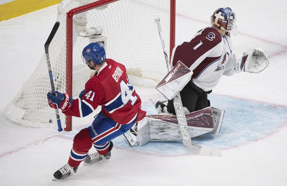 Montreal Canadiens' Paul Byron scores against Colorado Avalanche goaltender Semyon Varlamov during first period NHL hockey action in Montreal, Saturday, Dec. 10, 2016. (Graham Hughes/The Canadian Press via AP)