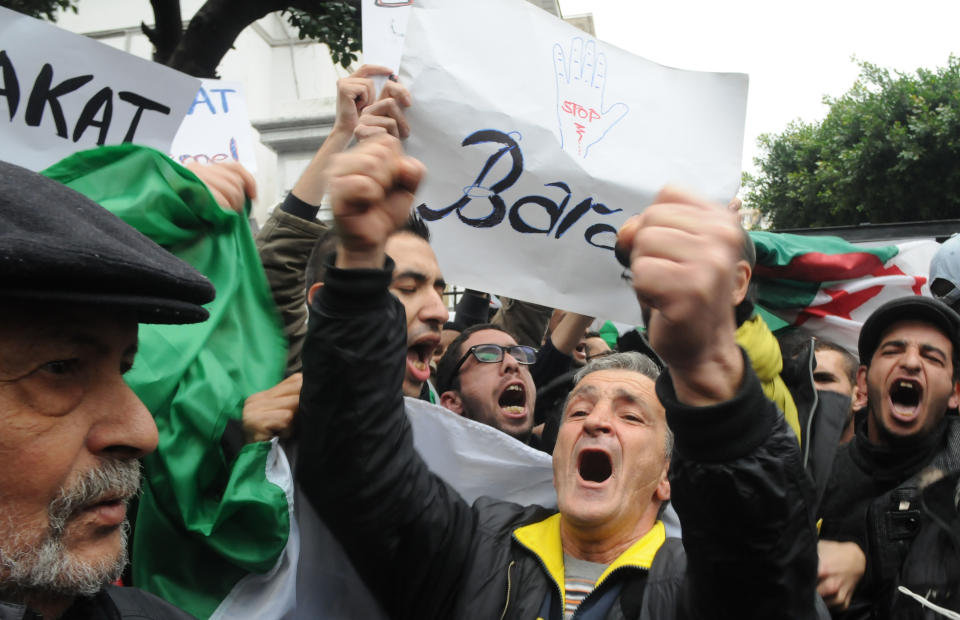 Demonstrators from the "Barakat!" ("Enough") group, protest during a rally against Algerian President Abdelaziz Bouteflika, Saturday, March 15, 2014 in Algiers. About 100 Algerian activists from a new anti-government movement staged a rare protest Saturday against the ailing president and his decision to run for a fourth term. Elections will take place on April 17, 2014. ( AP Photo/Ouahab Hebbat)