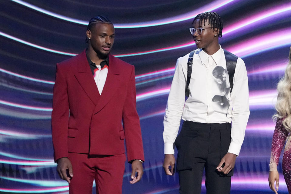 Bronny James, left, and Bryce James walk out to present their father, Los Angeles Lakers' LeBron James, with the award for best record-breaking performance at the ESPY awards July 12, 2023, in Los Angeles. Bronny James was hospitalized in stable condition Tuesday, July 25, a day after going into cardiac arrest while participating in a practice at the University of Southern California, a family spokesman said. (AP Photo/Mark J. Terrill)