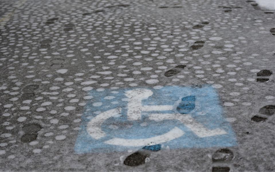 A handicapped parking spot in a lot between South 4th and 5th Streets is covered in wet, mushy snow Jan. 25, 2023.