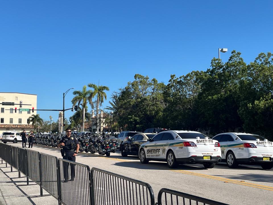 Law enforcement vehicles line up at the federal courthouse in Fort Pierce, ready to lead an exiting former President Donald Trump when he decides to leave the closed hearing in his criminal documents case. It could last until 2 p.m.