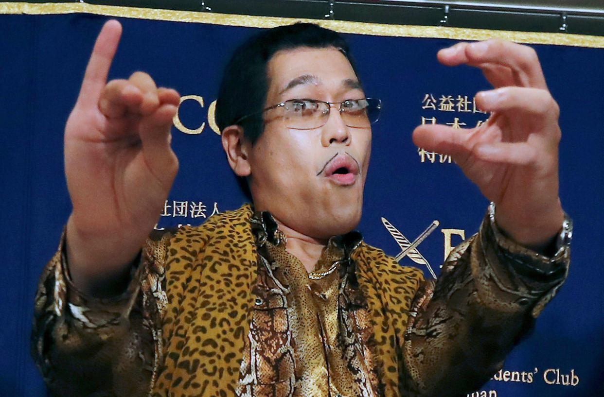 Japanese comedian Pikotaro performing the “pen-pineapple-apple-pen” song at a press conference in Tokyo. (Photo: AP)