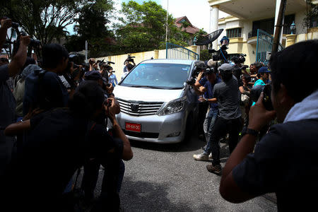 Members of the media surround a North Korea official's car as it leaves the North Korea embassy in Kuala Lumpur, Malaysia. REUTERS/Athit Perawongmetha