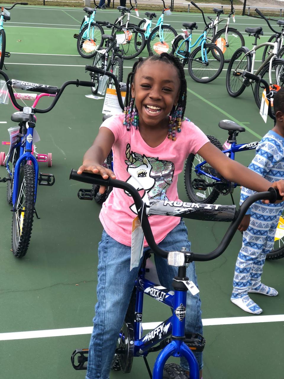 A girl was all smiles as she hopped on her new bike for the first time at last year's annual Christmas bike giveaway in Daytona Beach.