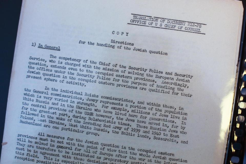 A copy of a translated document from the Nuremberg Trials titled 'Directions for the handling of the Jewish question' is on display in Berlin, Wednesday, Jan. 22, 2014. A collection of documents used by prosecutors at the Nuremberg Trials to help convict top Nazis is being put on public display in Berlin ahead of its auction in Israel. The Berlin Jewish Education Center says the documents going on display Wednesday were discovered by a collector at a flea market in Israel a half year ago and are to be auctioned Jan. 29. Many are English translations of Nazi documents used by prosecutors in their cases against Nazis like Hermann Goering and Rudolf Hess, who were convicted at the international tribunal after the war. (AP Photo/Markus Schreiber)