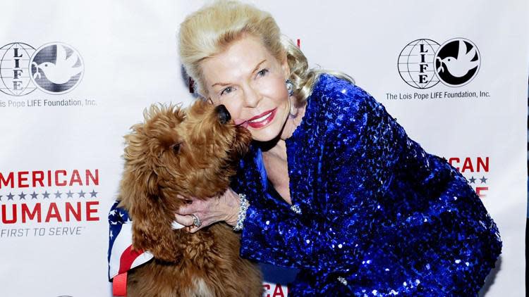 Palm Beach philanthropist Lois Pope with Patton, a golden retriever and poodle mix, who she offered to give to Donald Trump when he became president. He declined.