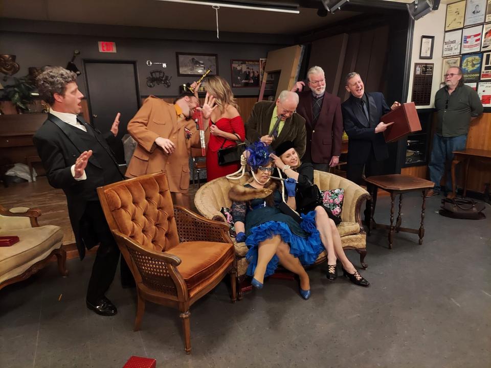 The cast of The Masquers' show Clue. Pictured from row, from left: Kathy Kowalski as Mrs. Peacock and Darcy Gravelle as Mrs. White. And back row, from left: Tim Brey as Wadsworth, Patrick Schamburek as Colonel Mustard, Warren Schmidt as Mr. Green, Corrie Skubal as Miss Scarlet, Paul Hacker as Professor Plum and Bruce Bitter as Mr. Boddy.