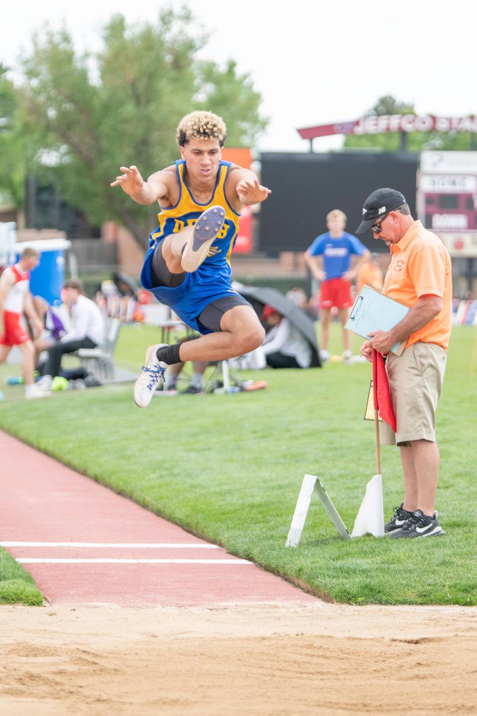 Dolores Huerta's Cameron Smith sails through the air during the Class 2A long jump finals at the state track and field meet on Thursday, May 19, 2022 at Jeffco Stadium.