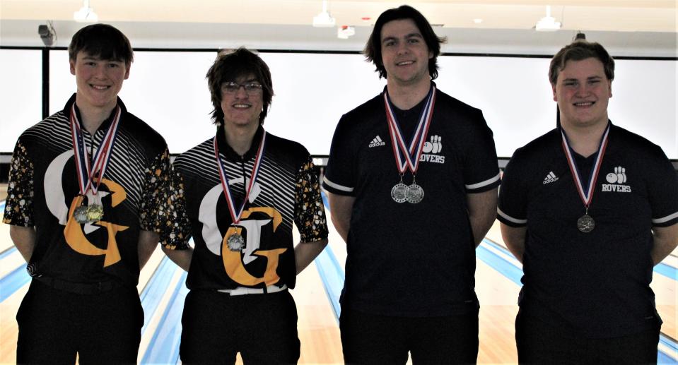 Scoring high games and series in Division II boys were, from left, Tyler Bortz of Garfield, Morgan Martin of Garfield, Mason Bartholomy of Rootstown and Jason Day of Rootstown.