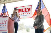 Sen. Kelly Loeffler, R-Ga., and Republican congressional candidate Marjorie Taylor Greene speak during a news conference on Thursday, Oct. 15, 2020, in Dallas, Ga. (AP Photo/Brynn Anderson)