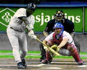 San Diego\'s Tony Gwynn reaches down to smack his 3,000th hit into center field in thr first inning of the Padres\' 12-10 win over Montreal Friday. AP photo