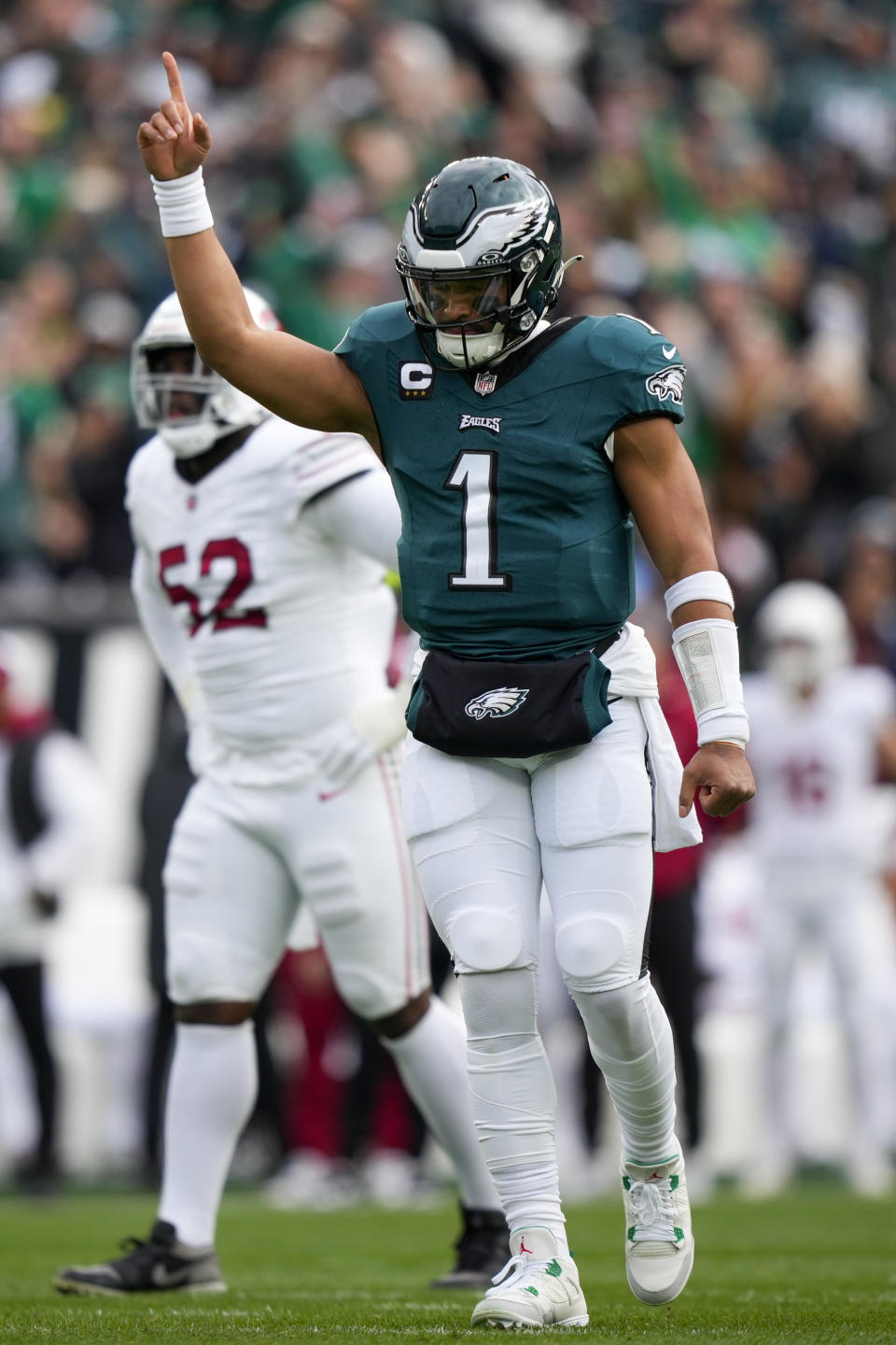 Philadelphia Eagles quarterback Jalen Hurts (1) gestures after throwing a touchdown pass to wide receiver Julio Jones during the first half of an NFL football game against the Arizona Cardinals, Sunday, Dec. 31, 2023, in Philadelphia. (AP Photo/Matt Slocum)