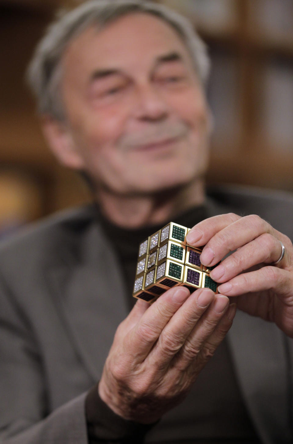 Erno Rubik, the inventor of the Rubik's Cube, poses for The Associated Press at Liberty Science Center, Wednesday, April 25, 2012, in Jersey City, N.J. The center is hosting an exhibit on Rubik's Cubes which will include a cube made with diamonds that is worth 2.5 million dollars. (AP Photo/Julio Cortez)