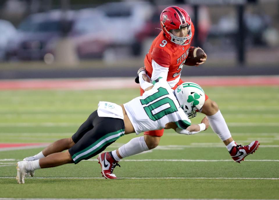 Carl Albert's Kevin Sperry Jr. Bishop McGuinness' Danny Bryan during the high school football game between Carl Albert and Bishop McGuinness at Carl Albert High School in Midwest City, Okla., Friday, Oct., 13, 2023.