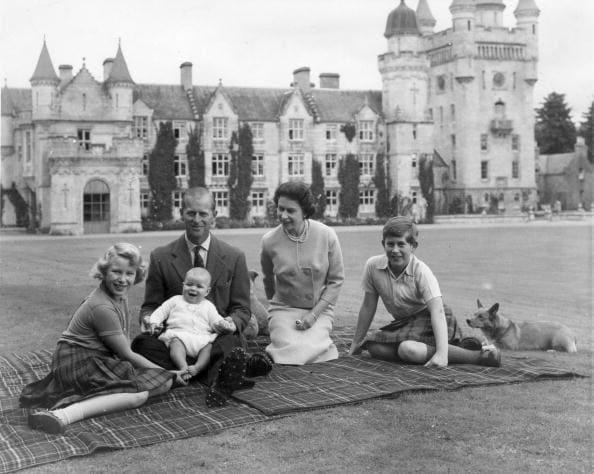 <div class="inline-image__caption"><p>9th September 1960: Queen Elizabeth II and Prince Philip, Duke of Edinburgh with their children, Prince Andrew (centre), Princess Anne (left) and Charles, Prince of Wales sitting on a picnic rug outside Balmoral Castle in Scotland.</p></div> <div class="inline-image__credit">Keystone/Getty Images</div>