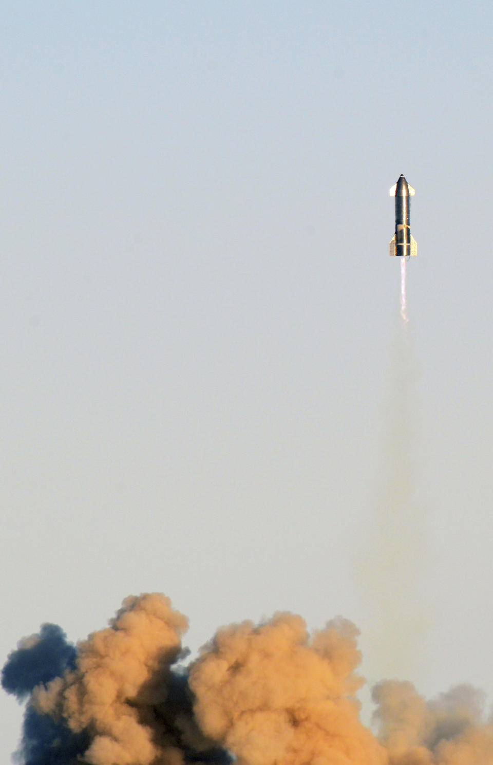 SpaceX's prototype starship takes off during a test flight, Wednesday, Dec. 9, 2020, at their Boca Chica, Texas facility. (Miguel Roberts/The Brownsville Herald via AP)