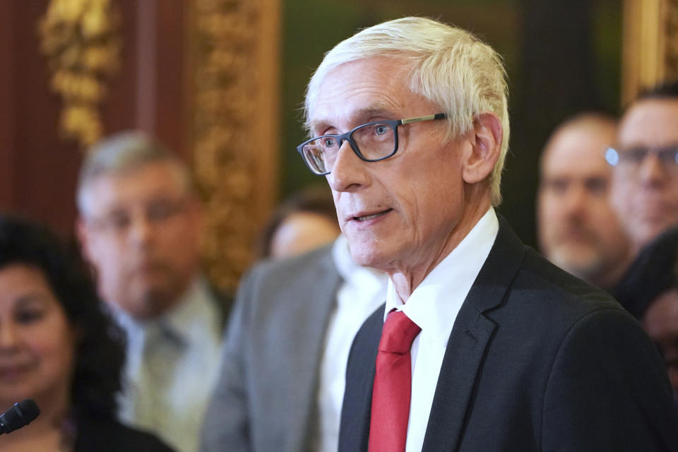 FILE - Wisconsin Gov. Tony Evers holds a news conference on Feb. 6, 2020, in Madison, Wis. Evers is known for his folksy demeanor, sprinkling his speeches with “by gollys” and the occasional PG-rated swear word. To win reelection, the 70-year-old grandfather and former teacher is trying to convince voters that he’s also a valiant defender of democracy and the lone figure ensuring their votes will still matter in 2024 and beyond. (Steve Apps/Wisconsin State Journal via AP, File)