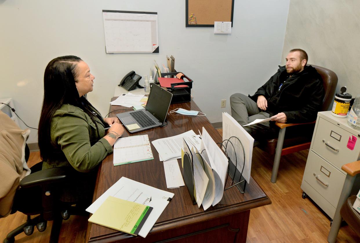 Director of shelter services Ronetta Hamilton, left, has a case collaboration consultation with housing case manager Matt Hamilton at Helping Hands of Springfield Wednesday Jan. 18, 2023.