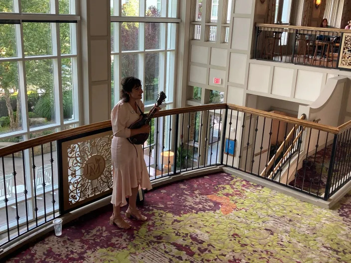 A singer performs in the lobby of the Dollywood DreamMore Resort.