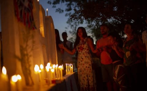 The relatives of victims and missing people ray during a vigil at the entrance to the city of Brumadinho - Credit: &nbsp;MAURO PIMENTEL/AFP