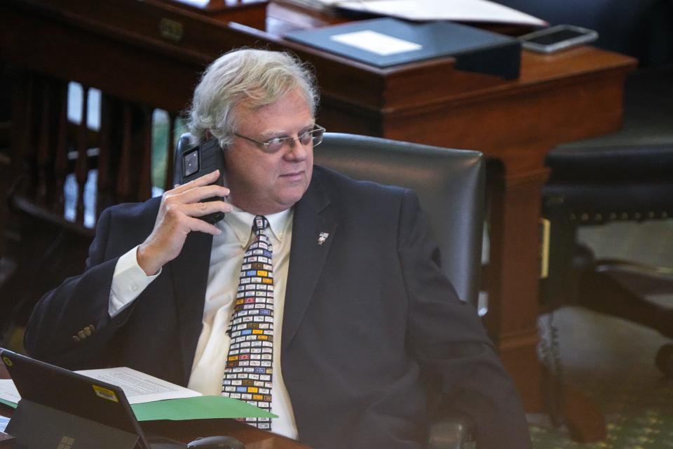 Sen. Paul Bettencourt talks on the phone during a hearing at the Capitol in March. Senate Bill 220, by Bettencourt, would provide the secretary of state, who serves as the chief elections officer in Texas, an avenue "to immediately address election violations as they are occurring," according to the bill's analysis.