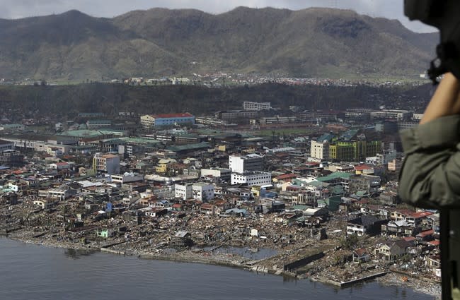 The devastation caused by Typhoon Haiyan, are seen Sunday, Nov. 10, 2013, in Tacloban city, Leyte province in central Philippines. Typhoon Haiyan, one of the most powerful storms on record, slammed into six central Philippine islands on Friday, leaving a wide swath of destruction and scores of people dead. (AP Photo/Toti Navales)