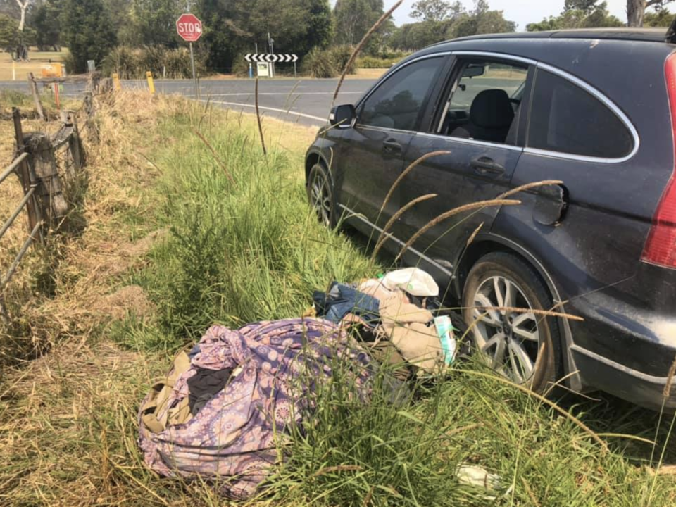 Some of the man's belongings were strewn across the side of the road next to his black car near Mullumbimby in NSW's north.