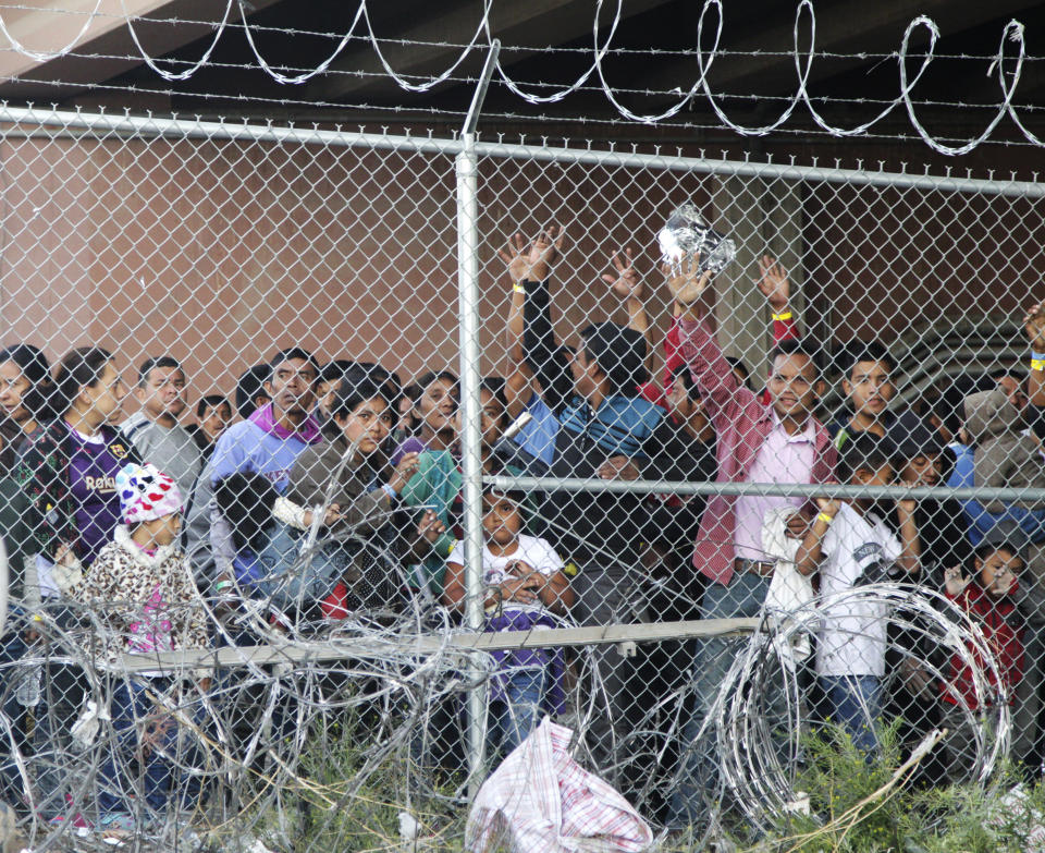 Central American adults and children stand imprisoned in a pen erected by U.S. Customs and Border Protection in El Paso, Texas, on March 27, 2019.&nbsp; (Photo: ASSOCIATED PRESS)