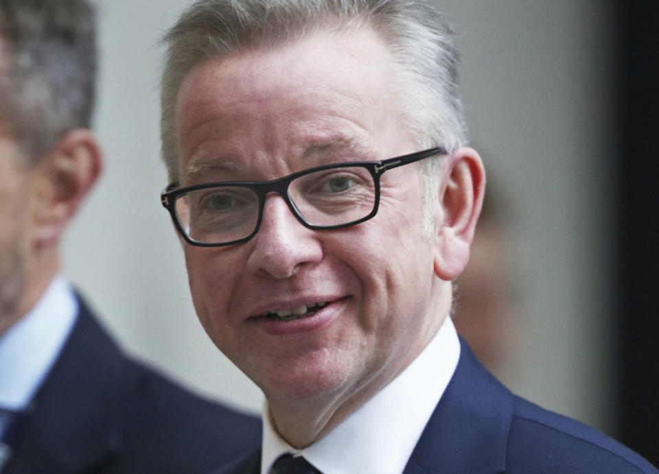 Conservative Party leadership contender Michael Gove arrives for a live TV debate with other contenders Tuesday June 18, 2019. Britain's Conservative Party will continue to hold elimination votes until the final two contenders will be put to a vote of party members nationwide, with the winner due to replace Prime Minister Theresa May as party leader and prime minister. (Yui Mok/PA via AP)