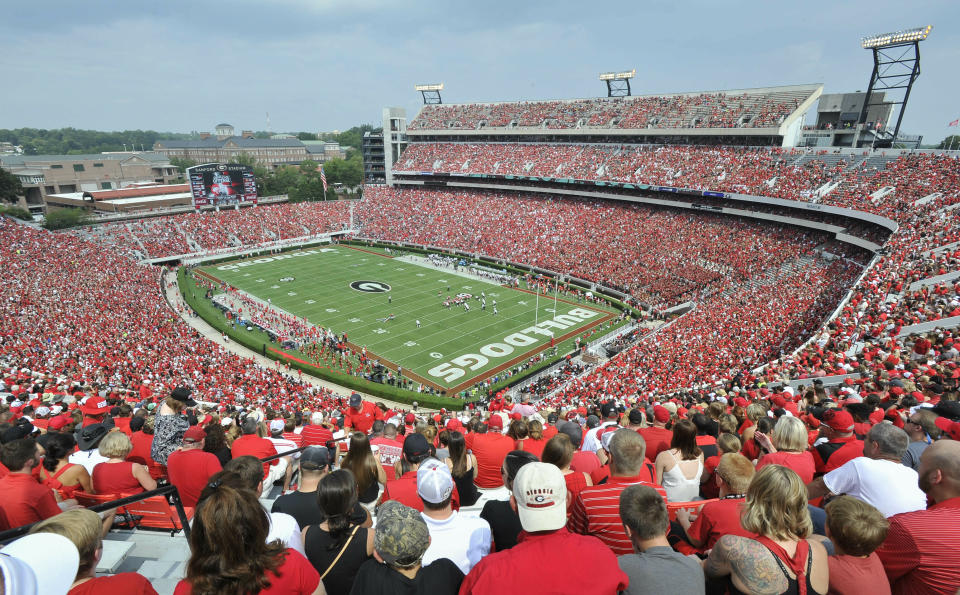 FILE - In this Sept. 5, 2015, file photo, Georgia fans watch the season opening NCAA college football game against Louisiana Monroe at Sanford Stadium n Athens, Ga. The Georgia Bulldog are planning to have fans between the hedges. The school announced ticket plans that call for allowing 20-25% capacity at 92,746-seat Sanford Stadium. (AP Photo/John Amis, File)