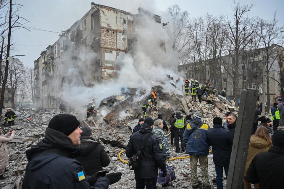 PHOTO: Ukrainian rescue and emergency workers attend the site of a missile attack in Kharkiv on Jan. 23, 2024.  (Sergey Bobok/AFP via Getty Images)