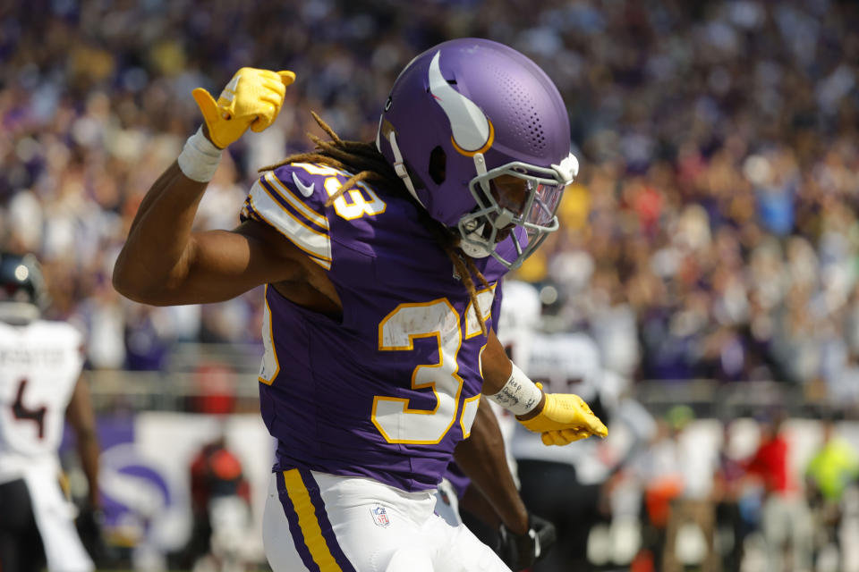 Minnesota Vikings running back Aaron Jones celebrates after catching an 8-yard touchdown pass during the first half of an NFL football game against the Houston Texans, Sunday, Sept. 22, 2024, in Minneapolis. (AP Photo/Bruce Kluckhohn)