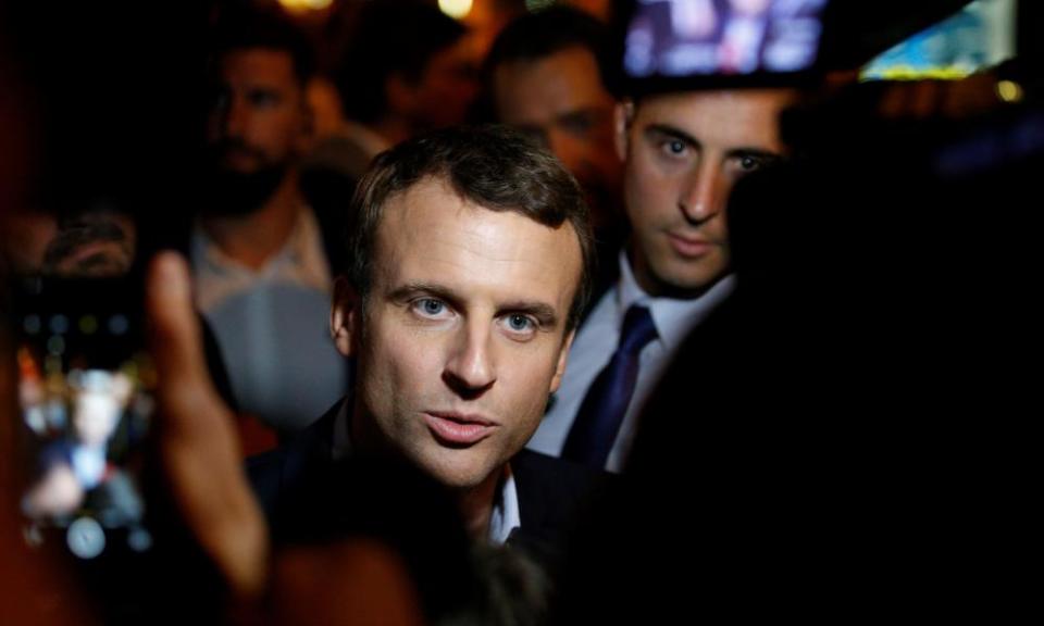 Emmanuel Macron talks to journalists after the first round of the presidential election