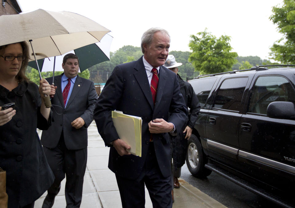 Rhode Island Gov. Lincoln Chafee, center, arrives at the state's Economic Development Corp. headquarters, Monday, May 21, 2012, in Providence, R.I. Former Boston Red Sox pitcher Curt Schilling and Rhode Island's economic development agency met Monday to discuss the finances of his troubled video game company. (AP Photo/Steven Senne)