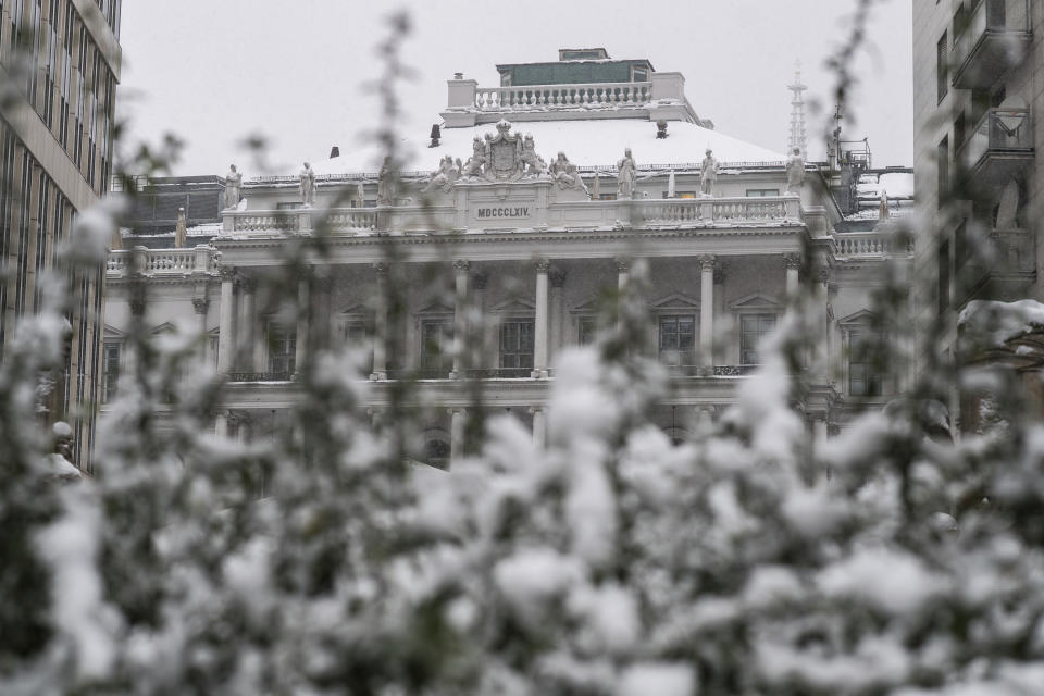 Palais Coburg where closed-door nuclear talks take place stand behind a snow covered bush in Vienna, Austria, Thursday, Dec. 09, 2021. (AP Photo/Michael Gruber)