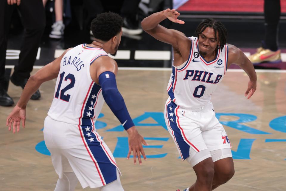 Game 4: Philadelphia 76ers guard Tyrese Maxey (0) celebrates with forward Tobias Harris (12) after a basket against the Brooklyn Nets.